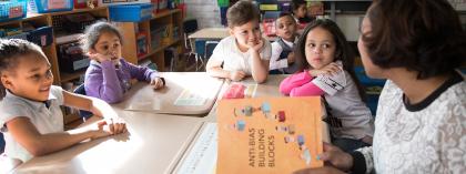 Teacher reading to young students