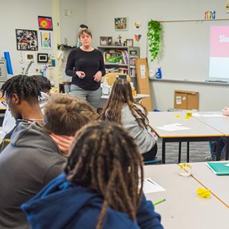 Teacher presenting a lesson in a classroom to students