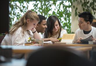 Students discussing at a table